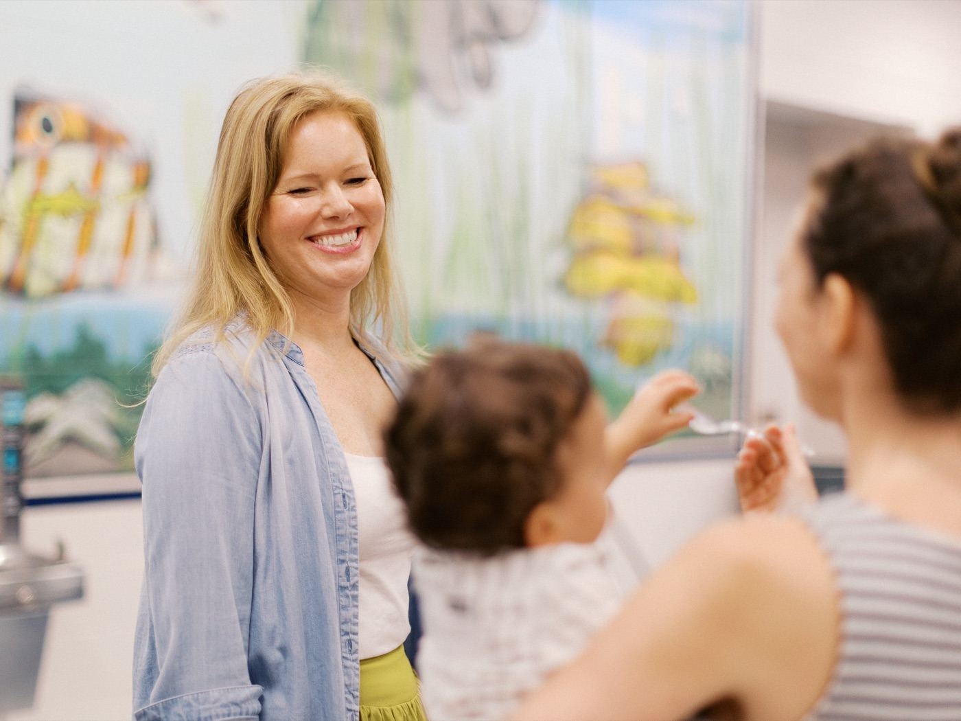 Woman smiling during a conversation at the church fellowship meal